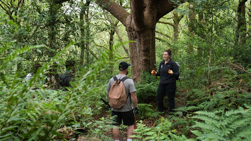 Liv briefing the group in the woods