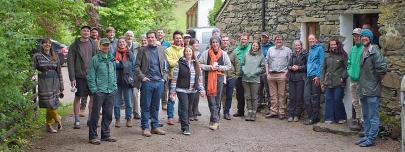 large group of people gathered in the farm yard