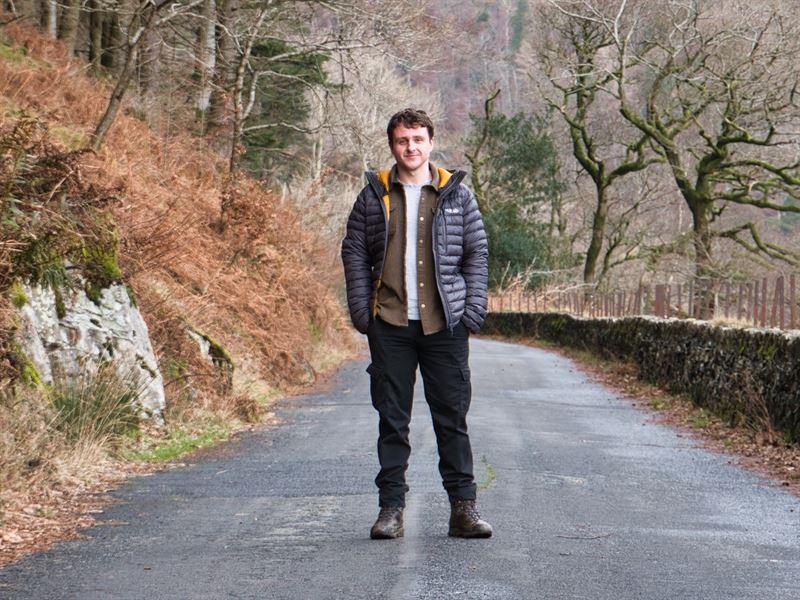 bryce standing on access road